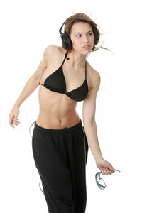 Portrait of young woman against white background