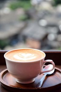 Close-up of cappuccino on table