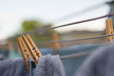 Close-up of clothespins on rope