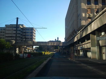 Street amidst buildings against sky in city