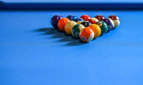 Close-up of pool balls arranged on table