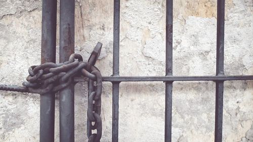 Close-up of padlock on gate