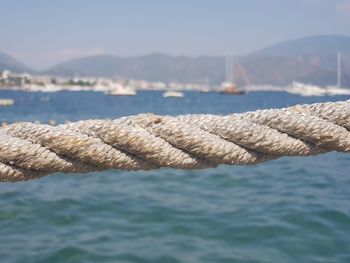 Close-up of rope against sea