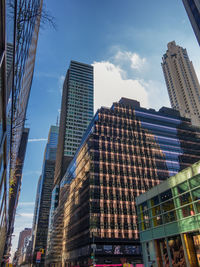 Low angle view of skyscrapers against sky