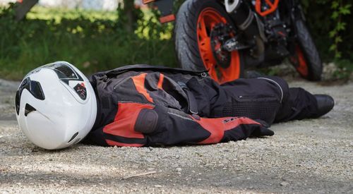 Low section of man standing on field
