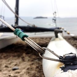 Close-up of boat moored at harbor