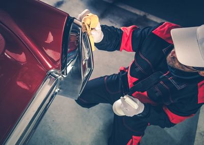 Man cleaning vintage car