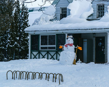 Snowman on snow during winter