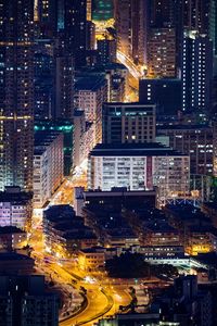 High angle view of illuminated buildings in city at night