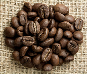 Close-up of coffee beans on table