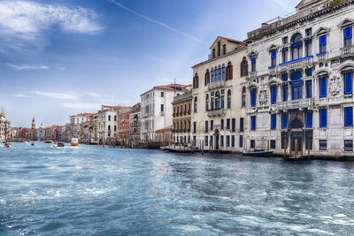 Canal amidst buildings in city