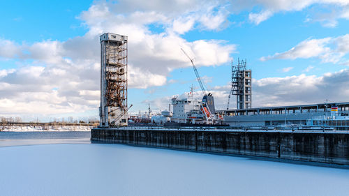 Pier over sea against sky