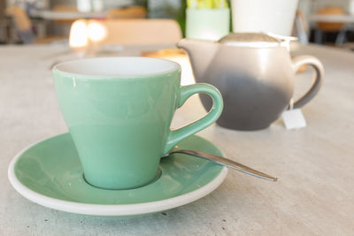 Close-up of coffee cup on table