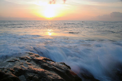 Scenic view of sea against sky during sunset