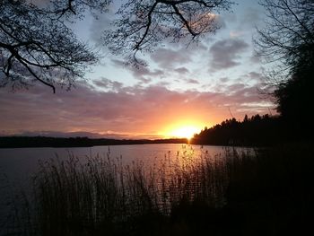 Scenic view of lake at sunset