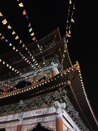 Low angle view of temple against sky at night