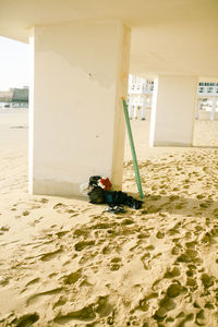 Deck chairs on beach by sea