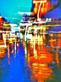 Reflection of illuminated lights on water at night