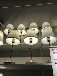 Close-up of illuminated lamp on table at home