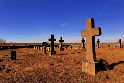 View of cemetery against blue sky