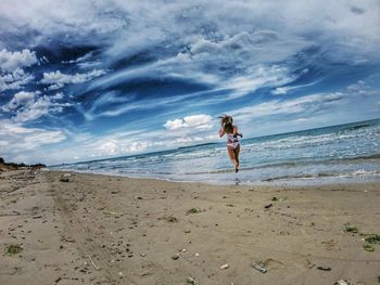 Man on beach against sky