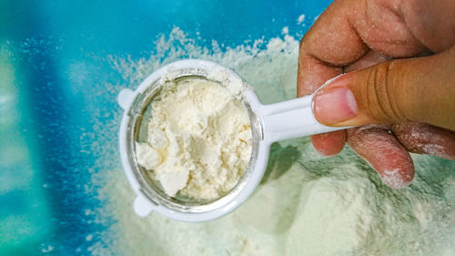 Close-up of hand holding ice cream