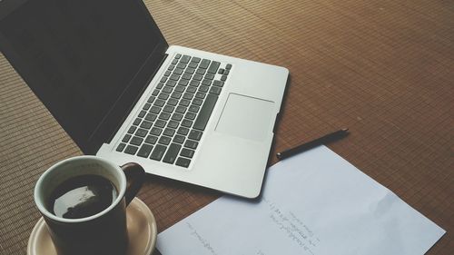 High angle view of coffee cup on table