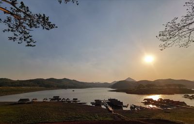 Scenic view of lake against sky during sunset