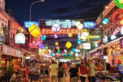 Illuminated lanterns hanging in city at night