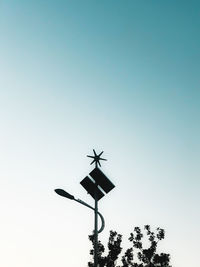Low angle view of silhouette tree against clear sky