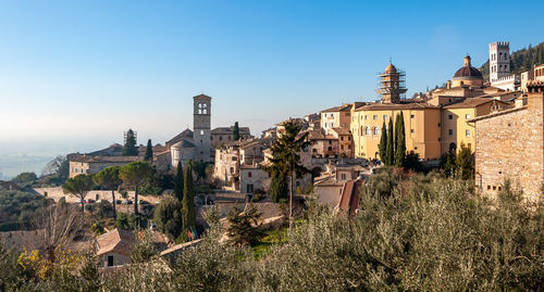 Panoramic view of buildings in city against clear sky