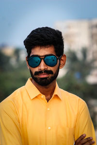 Portrait of young man wearing sunglasses