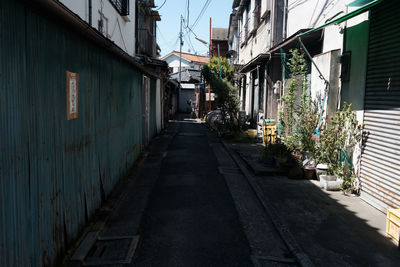 Alley amidst buildings against sky