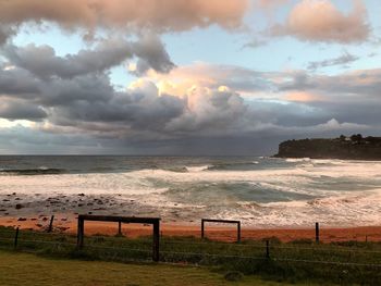 Scenic view of sea against storm clouds