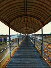 View of empty bridge over calm sea