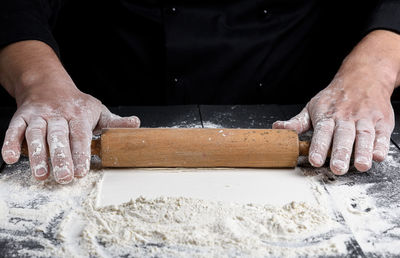 Midsection of chef preparing food