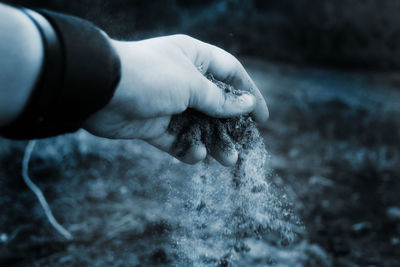 Close-up of hand holding water