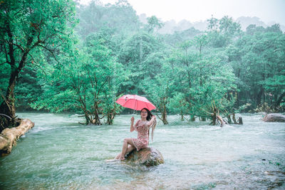 Woman sitting in a forest