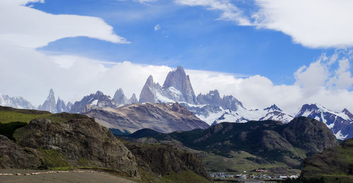 Scenic view of mountains against cloudy sky