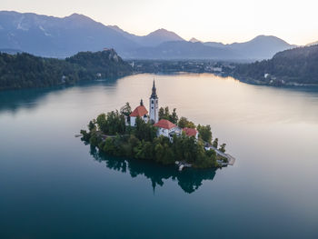 Aerial view of cerkev marijinega, a catholic church on a small island in the middle of bled lake 