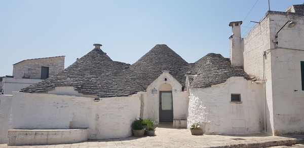 Exterior of old building against clear blue sky