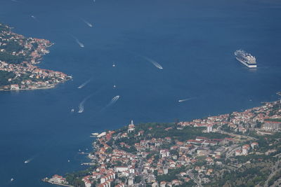 High angle view of sea and buildings in city