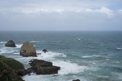 Beautiful rock formation in the sea view from the cliff at nugget point,new zealand.