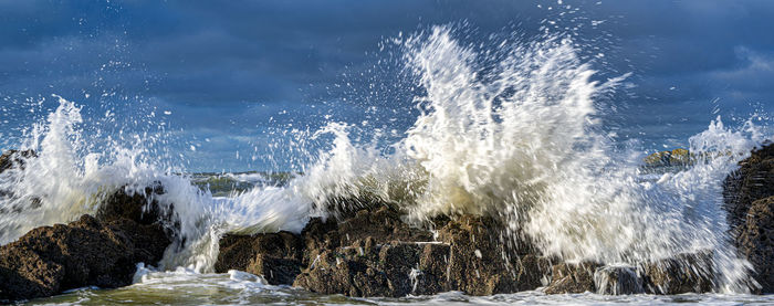 Sea waves splashing on rocks