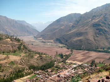 High angle view of road by mountains against sky