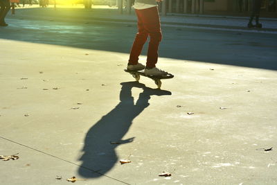 Low section of man standing on street