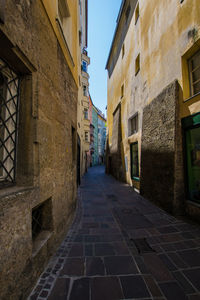 Narrow alley amidst buildings in city