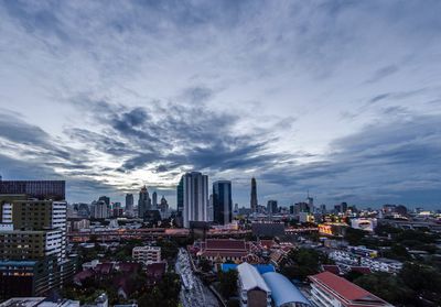 High angle view of buildings in city against sky