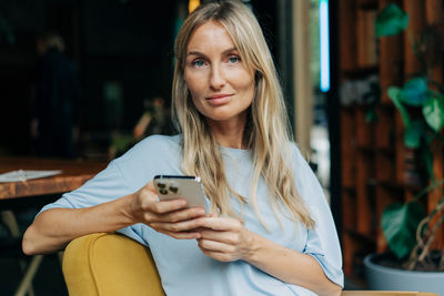 Young woman using mobile phone