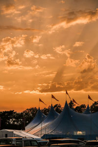 Panoramic view of festival against sky during sunset
